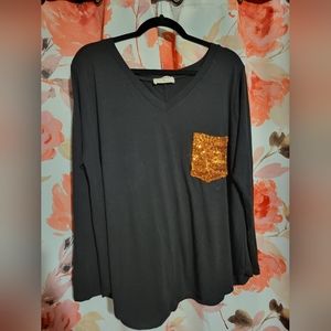 Long sleeve black shirt with orange glitter pocket